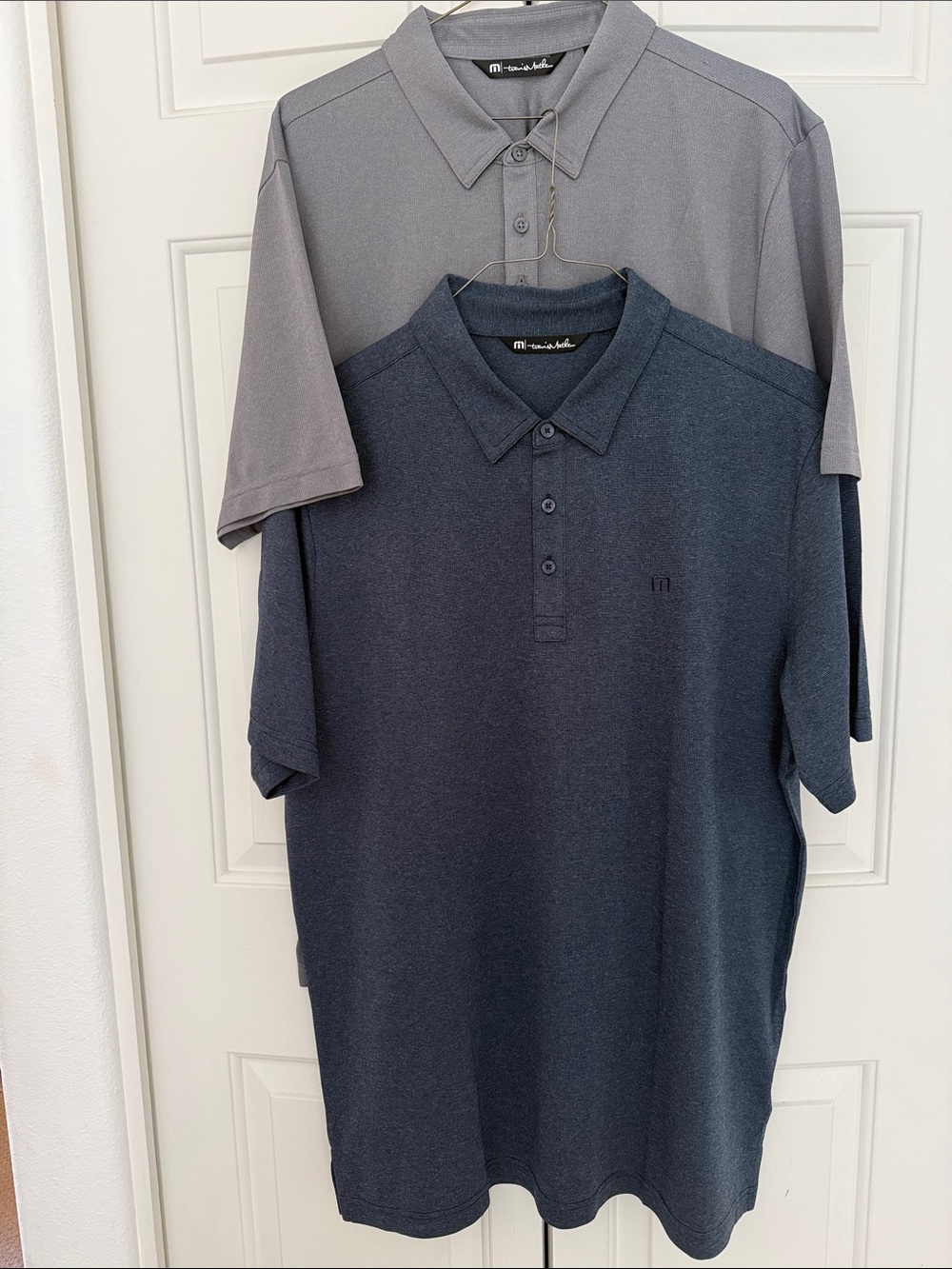 Two Travis Mathew performance polos, XL